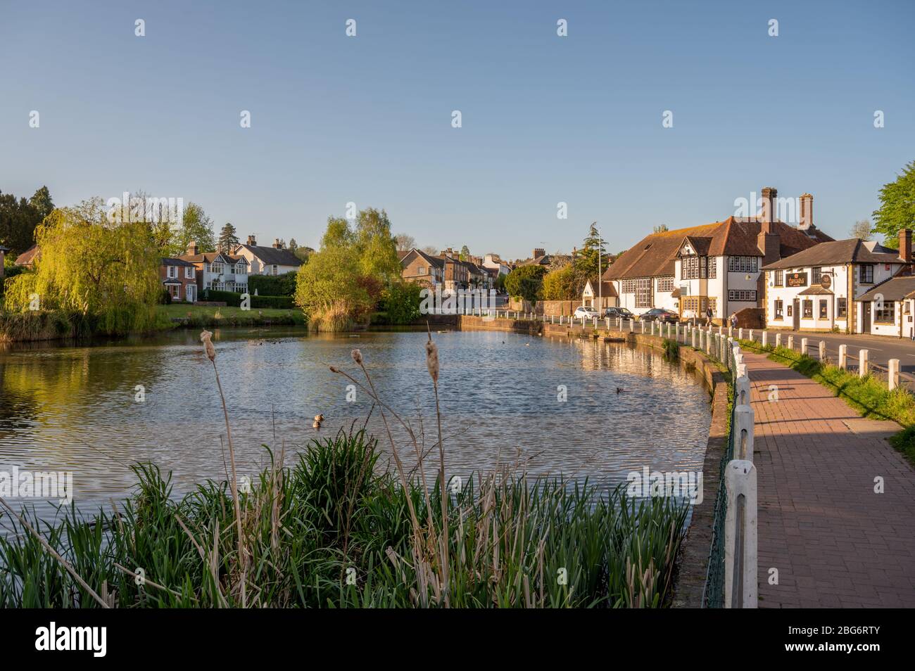 Sun setting over Lindfield village pond near Haywards Heath, West