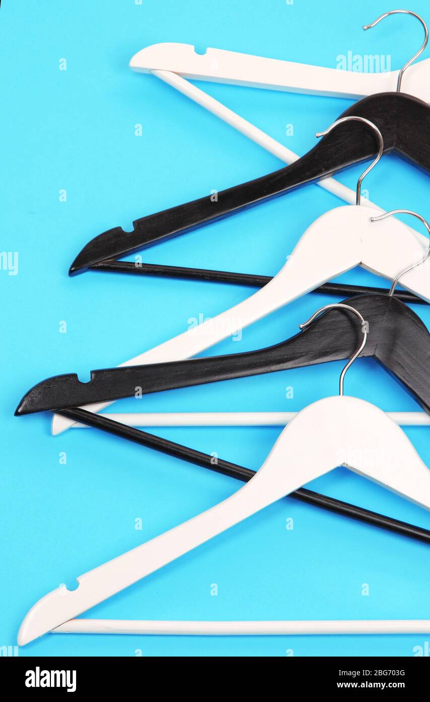 Black and white clothes hangers on color background Stock Photo Alamy