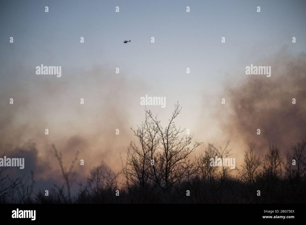 Kilpatrick Hills, Duntochter, Glasgow, UK. 20th Apr, 2020. Pictured: Huge plumes of dark smoke billow from a massive wildfire with massive flames on the Kilpatrick hills in Glasgow. Credit: Colin Fisher/Alamy Live News Stock Photo