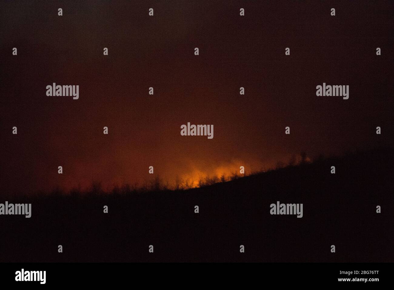 Kilpatrick Hills, Duntochter, Glasgow, UK. 20th Apr, 2020. Pictured: Huge plumes of dark smoke billow from a massive wildfire with massive flames on the Kilpatrick hills in Glasgow. Credit: Colin Fisher/Alamy Live News Stock Photo