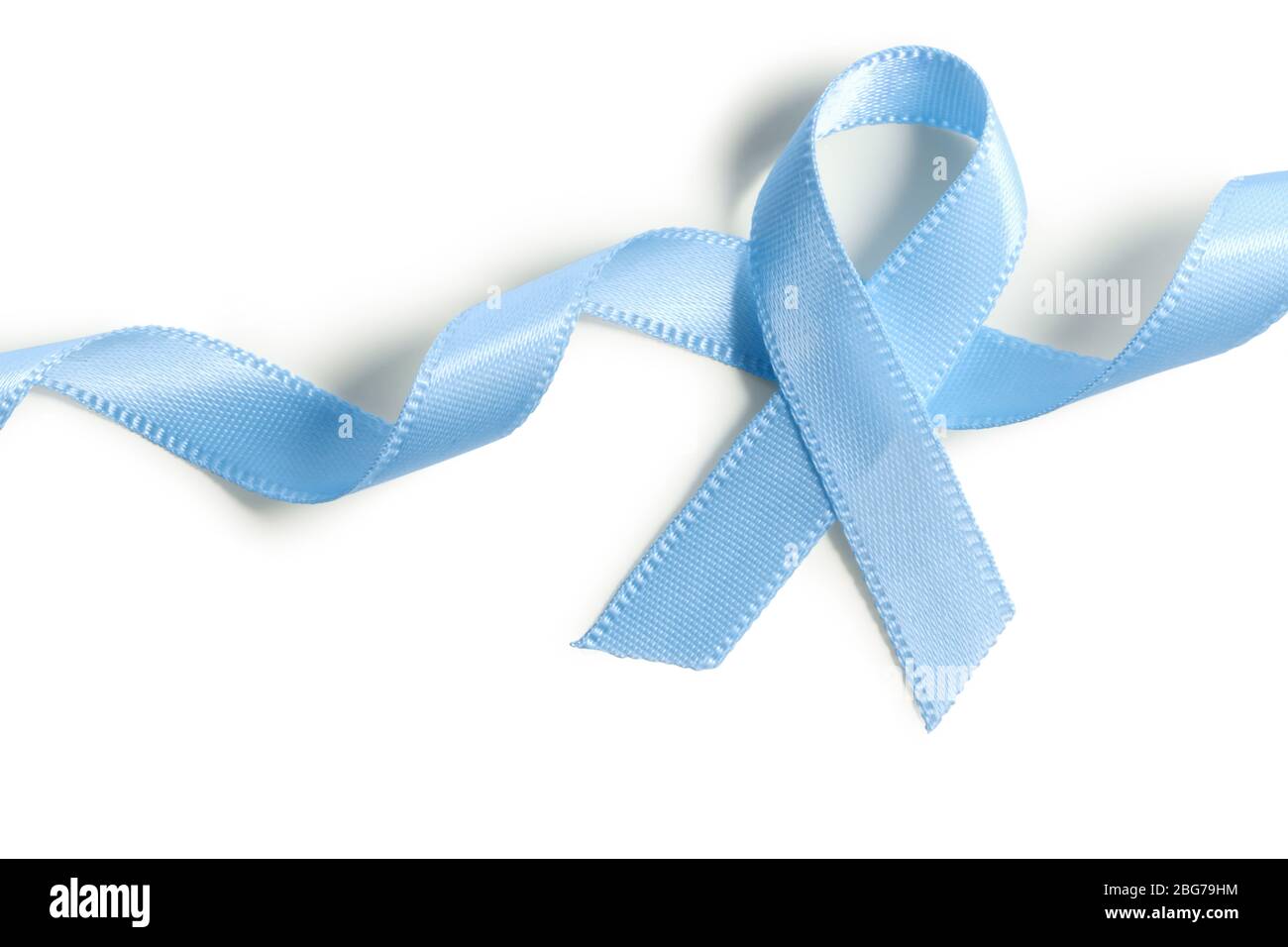 Blue ribbon symbolic prostate cancer awareness campaign and men health isolated on white with clipping path. Stock Photo