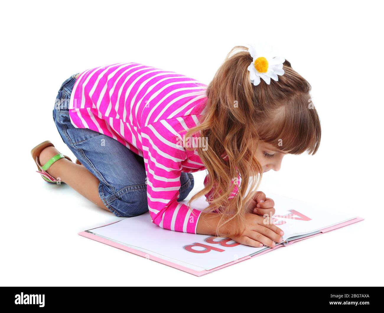 Little girl sitting on floor with book isolated on white Stock Photo ...