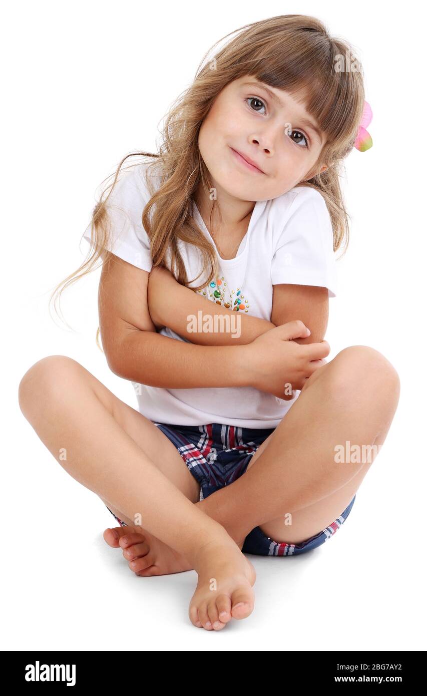 Little girl sitting on floor isolated on white Stock Photo - Alamy