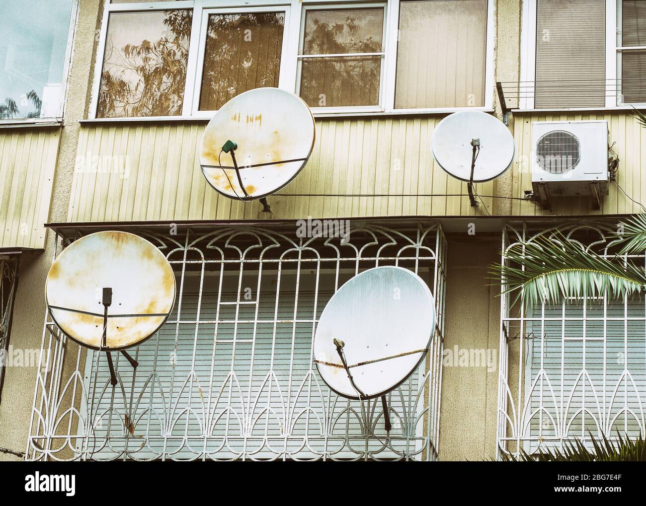 Balconies with satellite dishes and air conditioning Stock Photo Alamy
