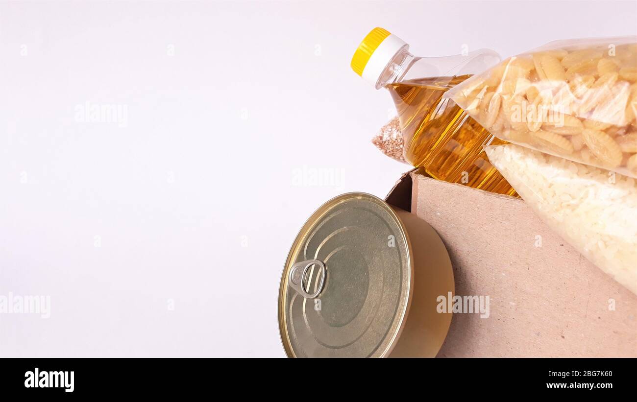 Sharing food concept. Delivery of products. donation box. Volunteer collecting food. Coronavirus pandemic help. close-up packing boxing.Support safe Stock Photo