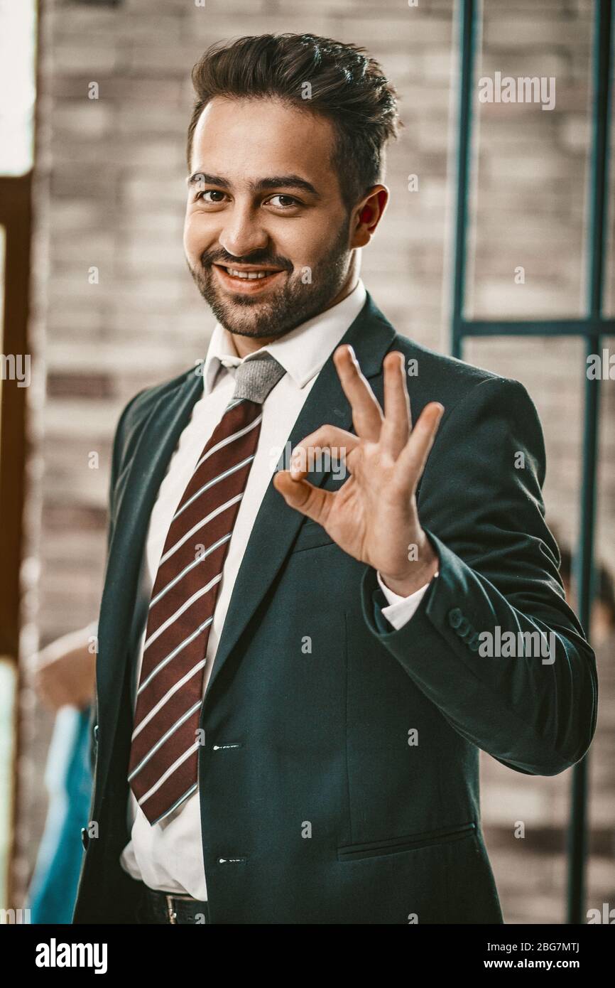 Okey gesture from Attractive successful businessman Stock Photo