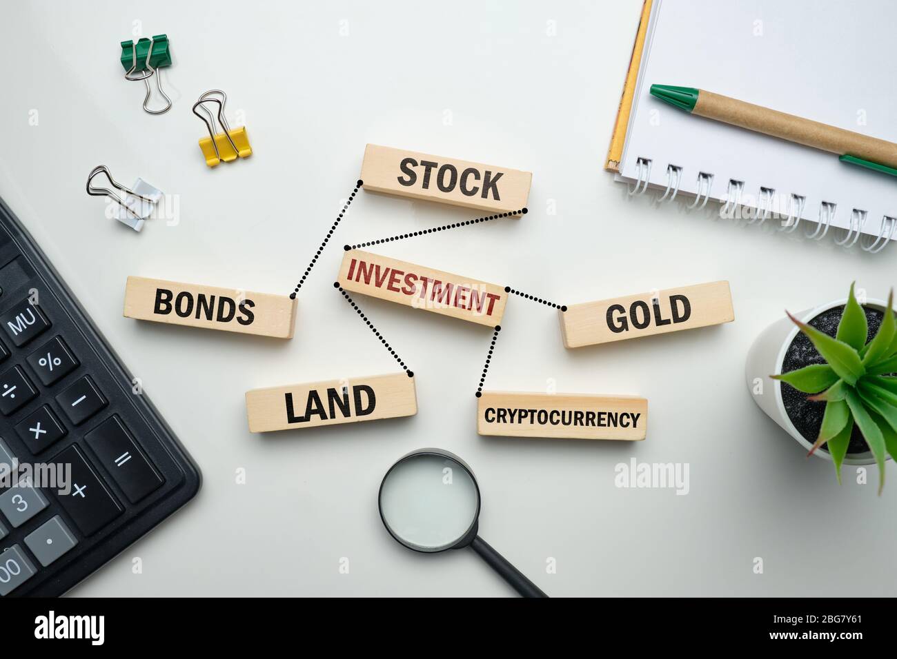 The concept of investing in stocks, gold, land, cryptocurrency. Close up  Stock Photo - Alamy