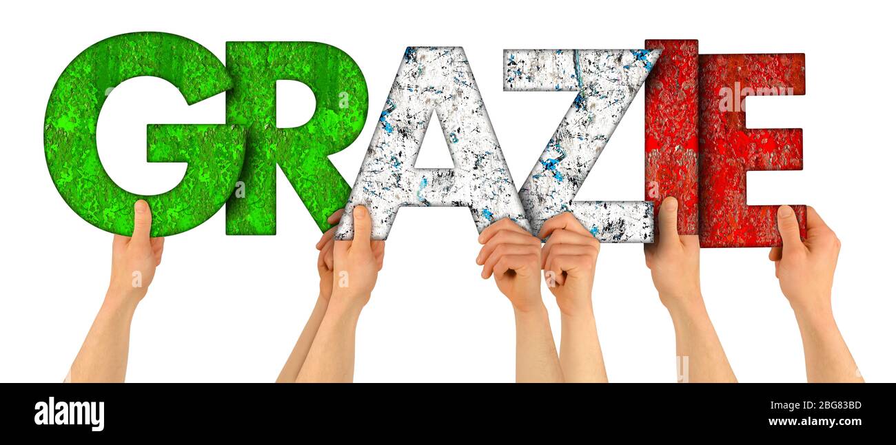 people holding up colorful red green italy flag wooden letter with italian word grazie ( english translation: thank you ) isolated on white background Stock Photo