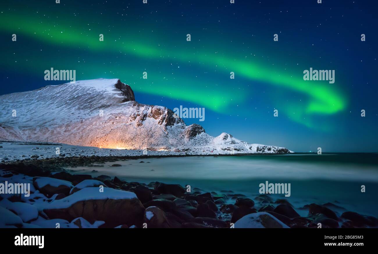Aurora borealis above Nordlandsnupen mountain, Lofoten Vaeroy, Norway Stock Photo
