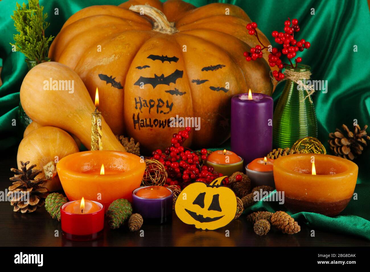 Composition for Halloween with pumpkins and candles close-up Stock ...