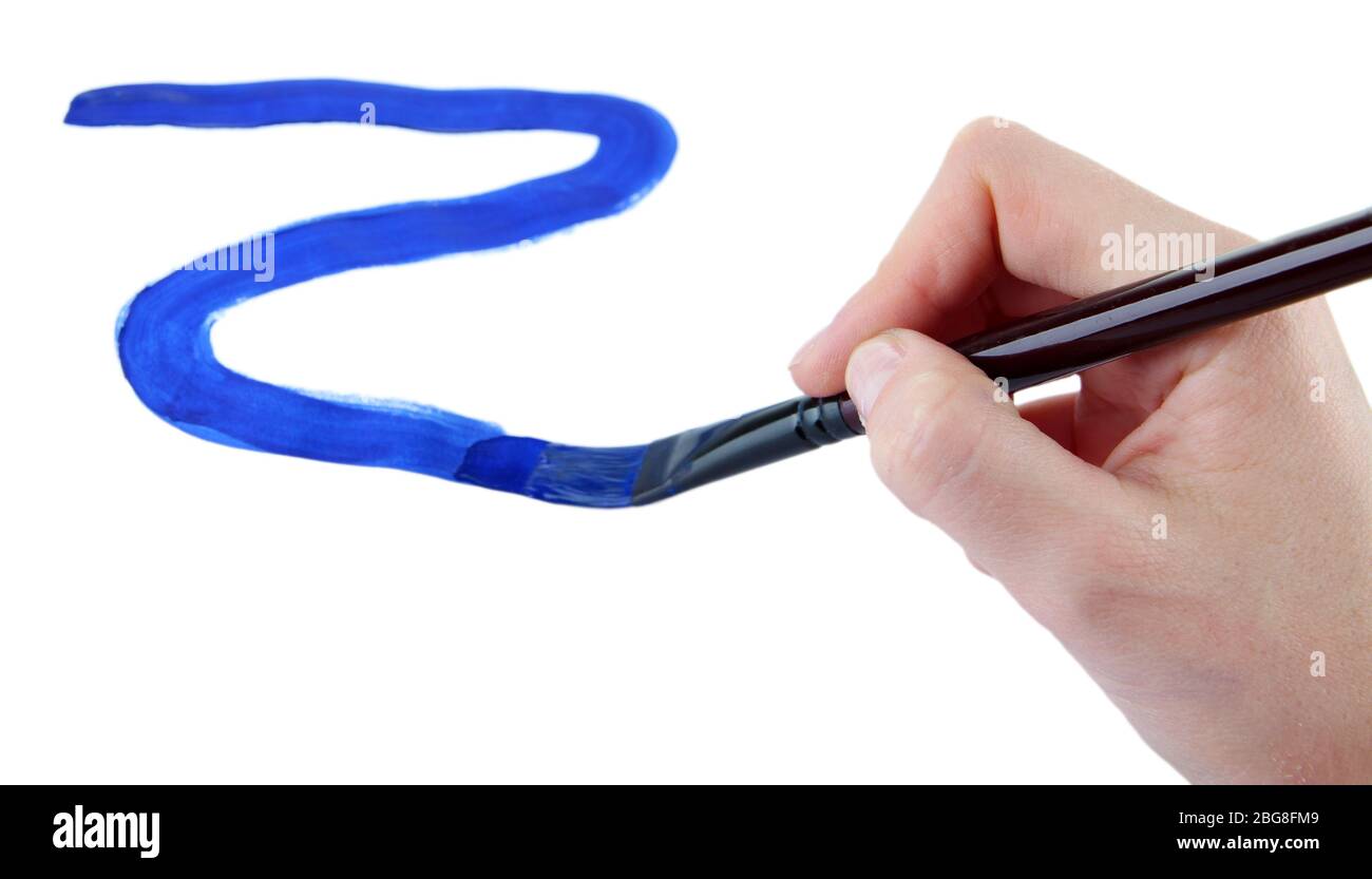 Hand holding brush with blue paint isolated on white Stock Photo - Alamy