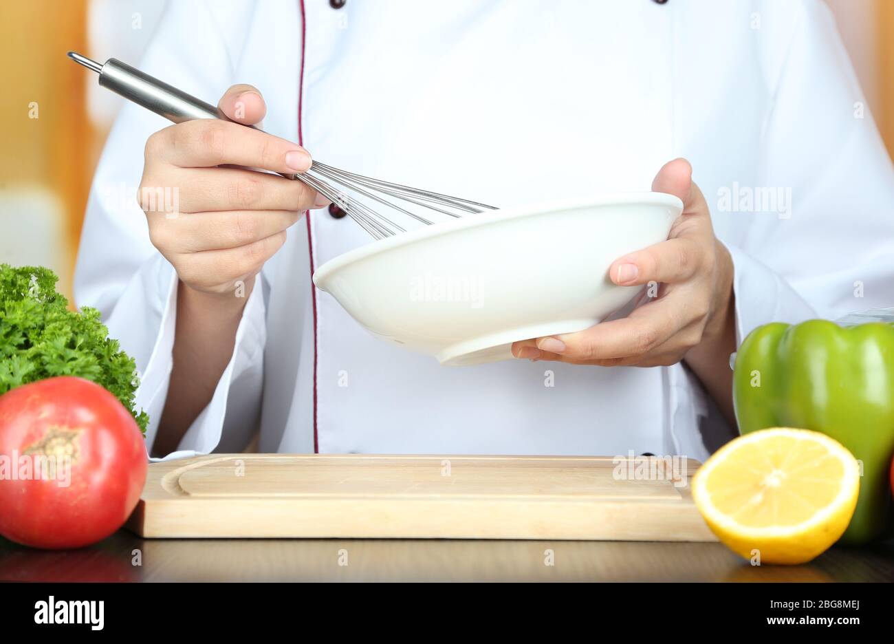 Cook hands whisking mayonnaise Stock Photo Alamy