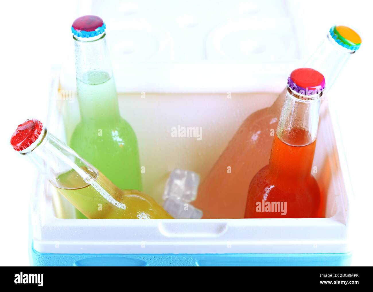 Drinks in glass bottles in mini fridge close up Stock Photo Alamy