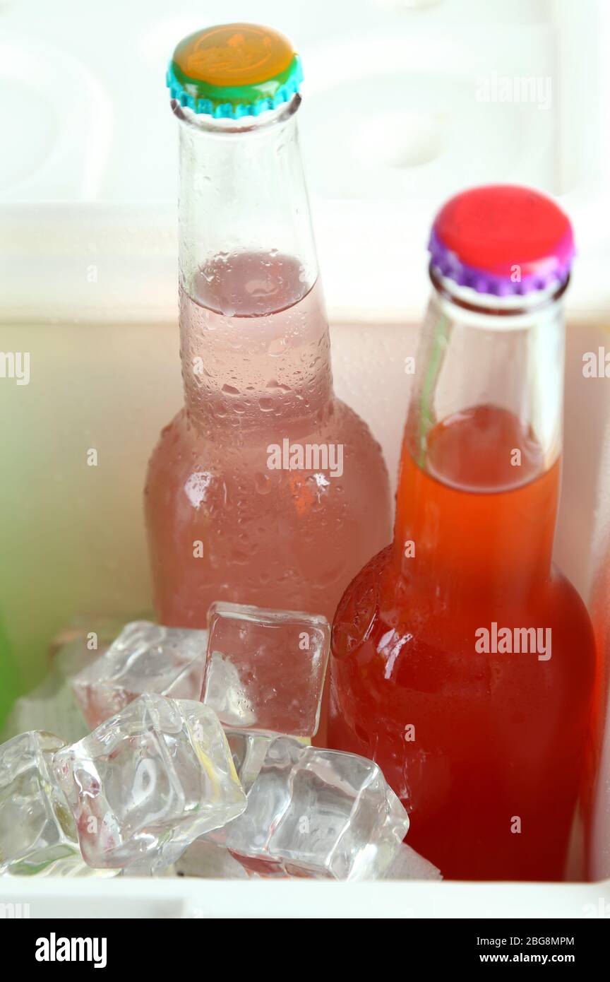 Drinks in glass bottles in mini fridge close up Stock Photo Alamy