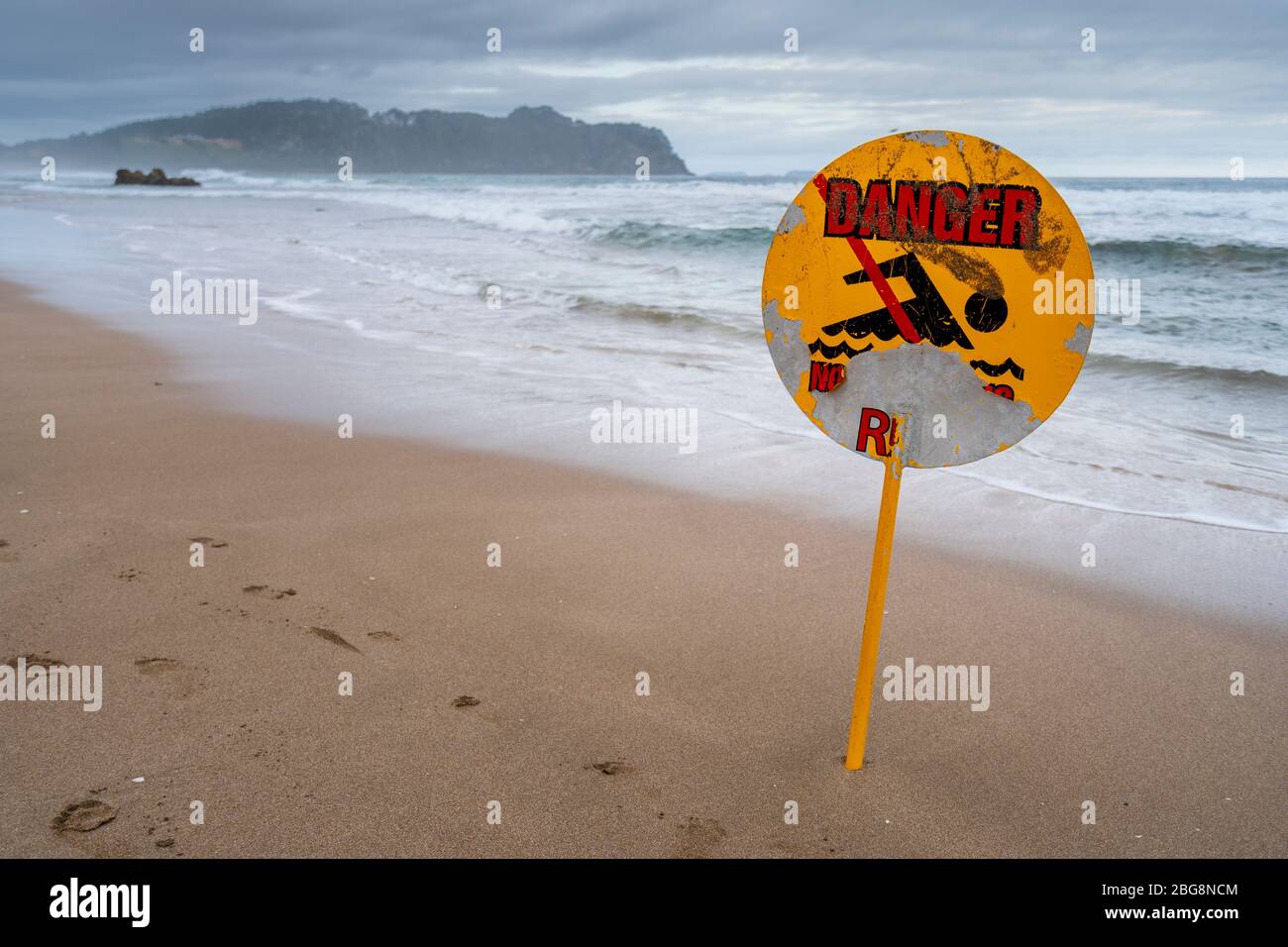 Danger sign on Hot Water Beach, Hahei, Coromandel Peninsula, North Island, New Zealand Stock Photo