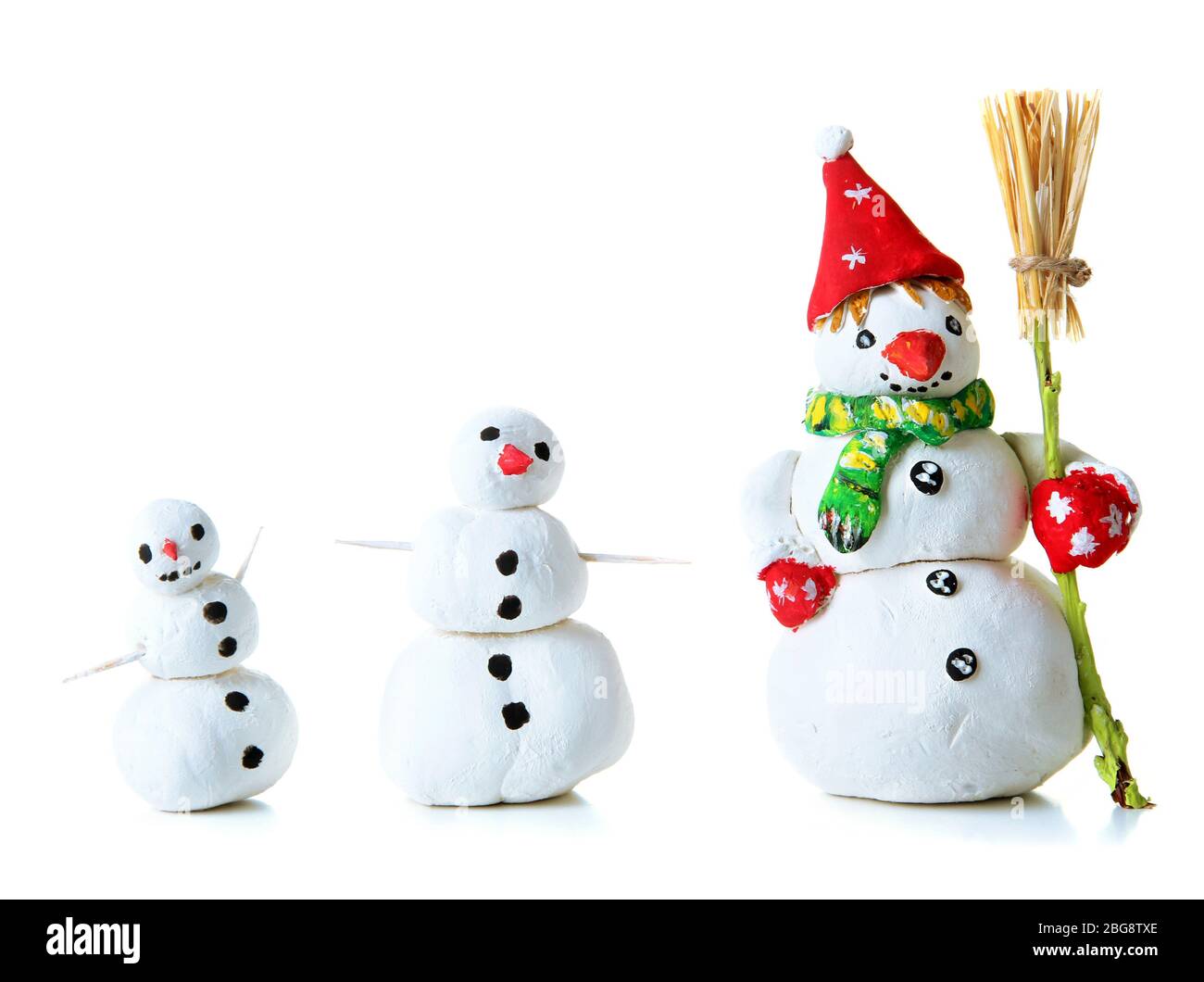 Beautiful snowmen isolated on white Stock Photo - Alamy