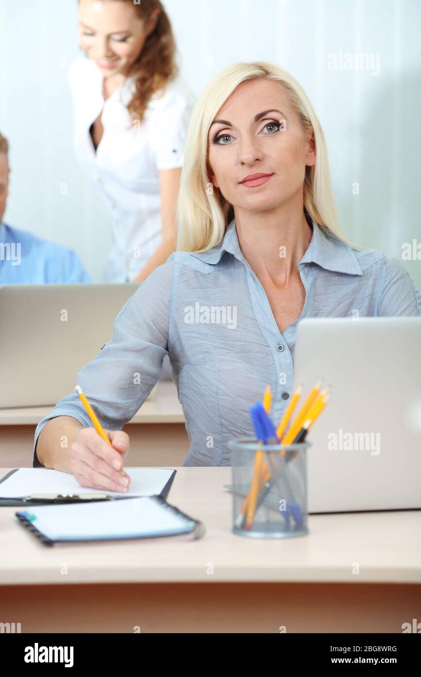 Office workers in workplace Stock Photo Alamy