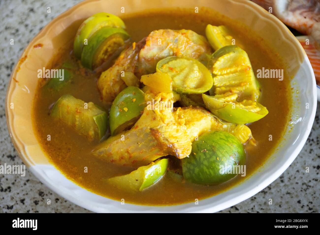 Thai Local Food Southern Style Spicy Sour Yellow Curry With Red Tilapia Fish And Green Eggplant In Bowl For Serve Lunch Meal To Family People At Count Stock Photo Alamy