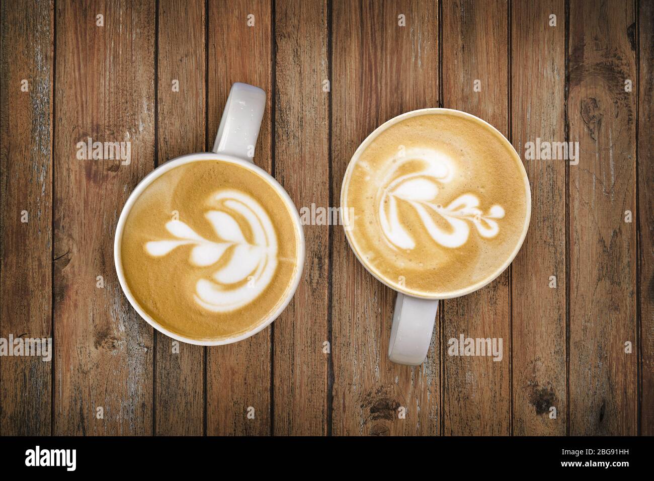 restjes Onderhandelen Pidgin late art from barista skill on coffee cup on wood table from top view at  cafe Stock Photo - Alamy