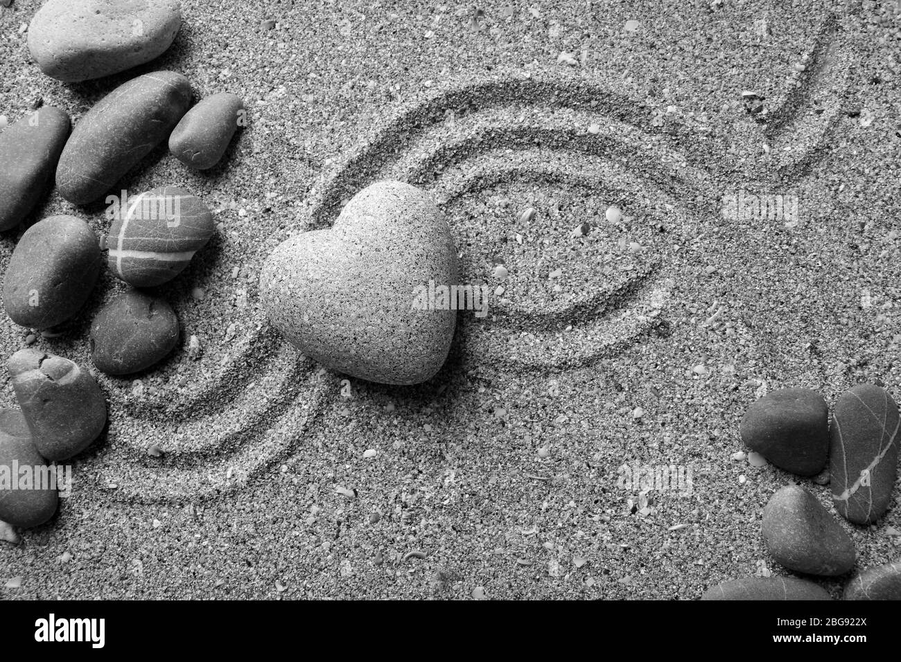 Grey Zen Stone In Shape Of Heart On Sand Background Stock Photo Alamy alamy