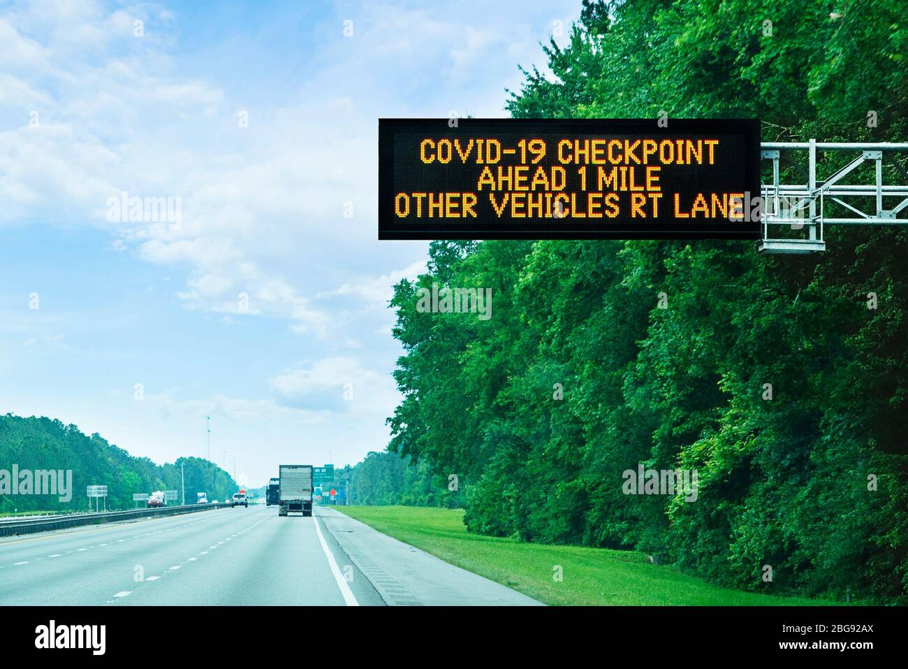 Covid-19 Checkpoint sign on I95 highway in Florida on state line border Stock Photo