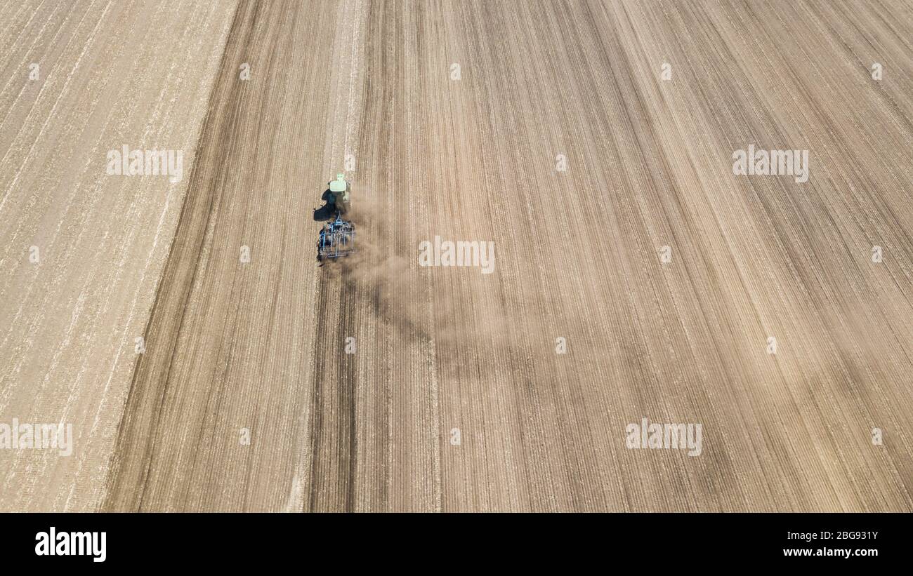 Meinersen, Germany. 20th Apr, 2020. A farmer is ploughing a field and ...