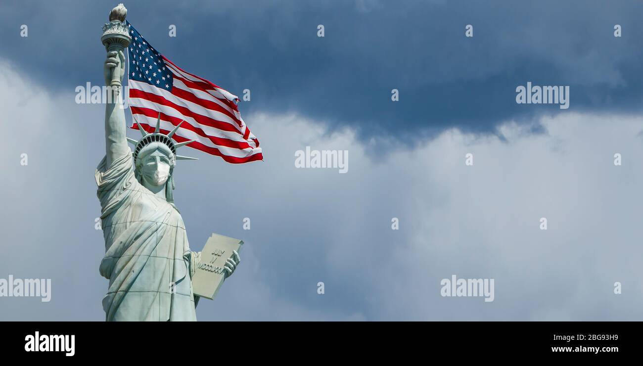 statue of liberty new york with medical surgical mask, covid-19