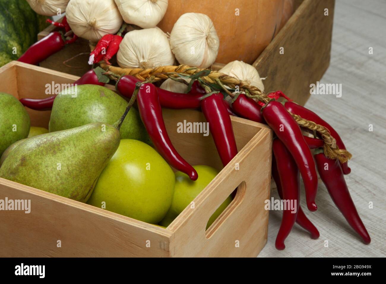 Fruits and vegetables in crates on wooden background Stock Photo - Alamy