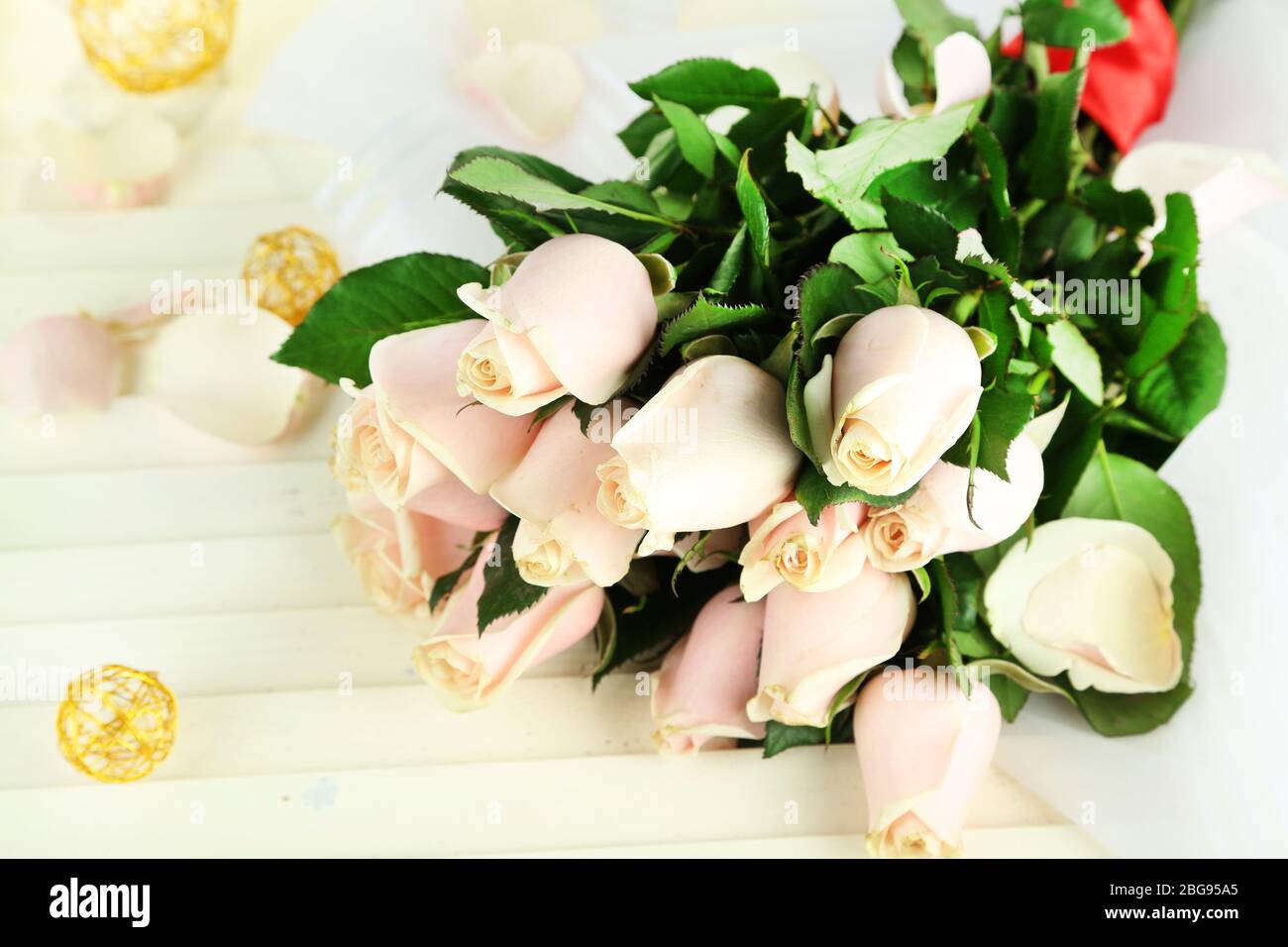 Beautiful bouquet of roses, on light background Stock Photo - Alamy