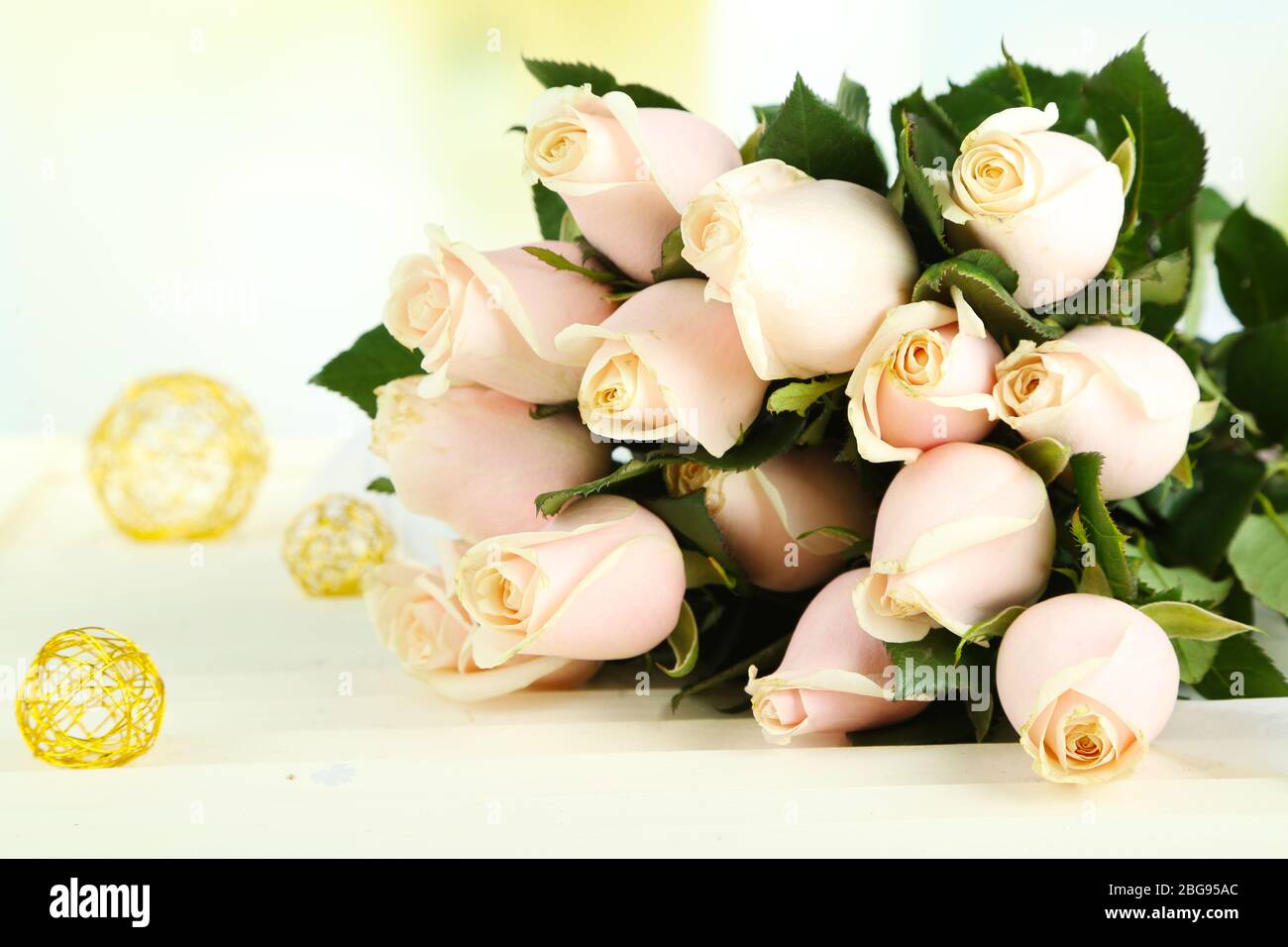 Beautiful bouquet of roses, on light background Stock Photo - Alamy