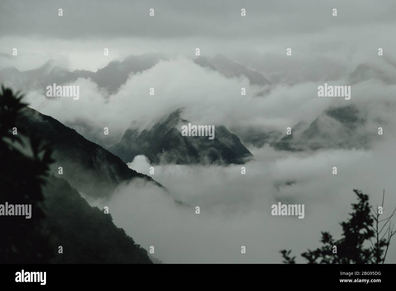 Beautiful view of  clouds among Andes mountain tops. Inca trail. Peru Stock Photo