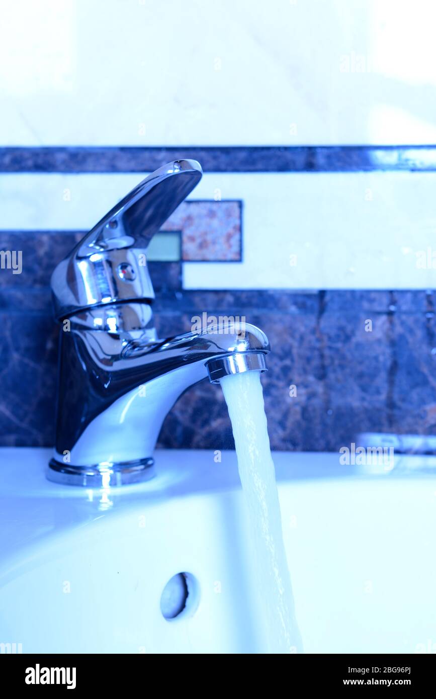 Ceramic sink with chrome fixture, close up Stock Photo Alamy
