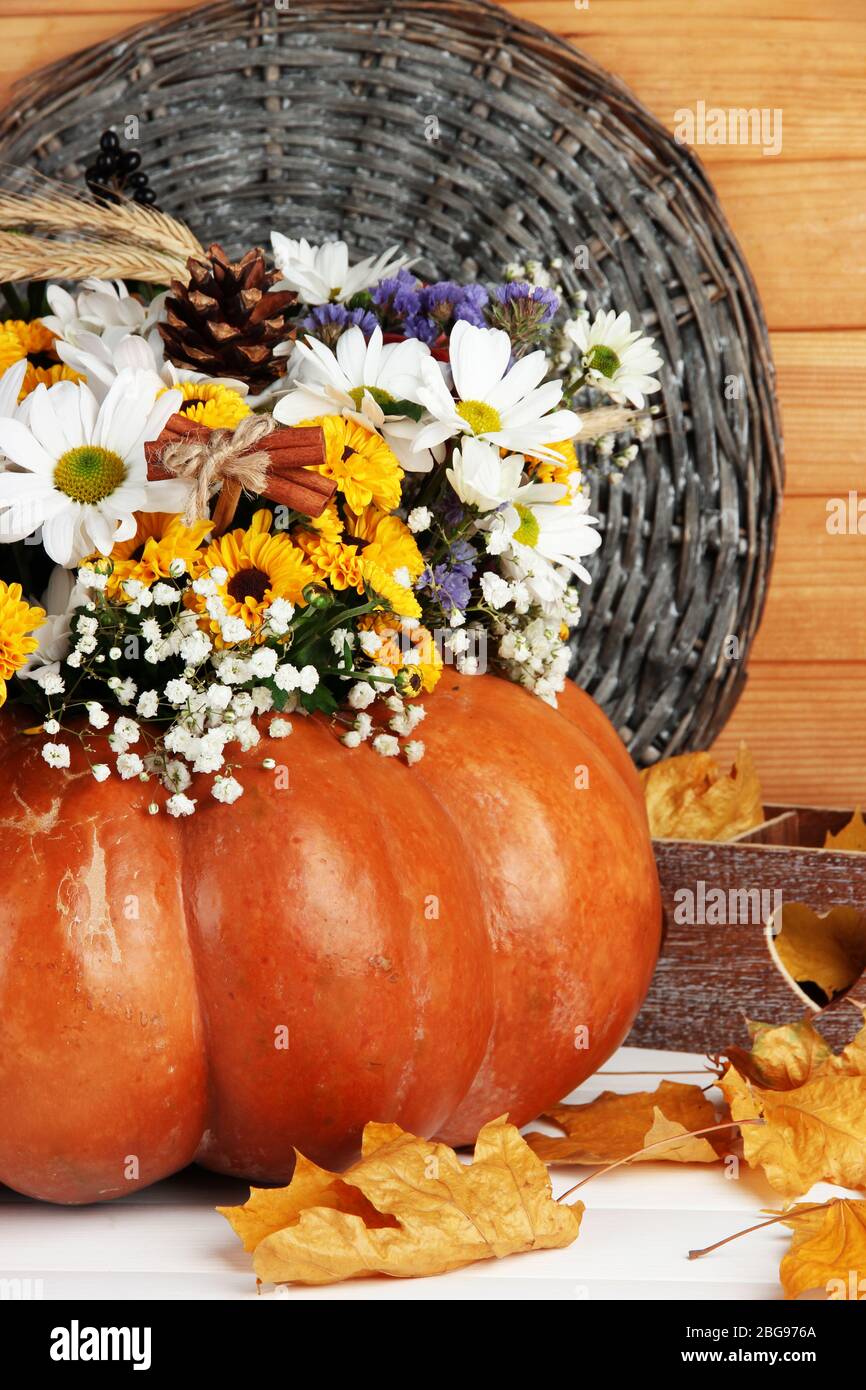 Beautiful autumn composition in pumpkin with decorative box on table on ...