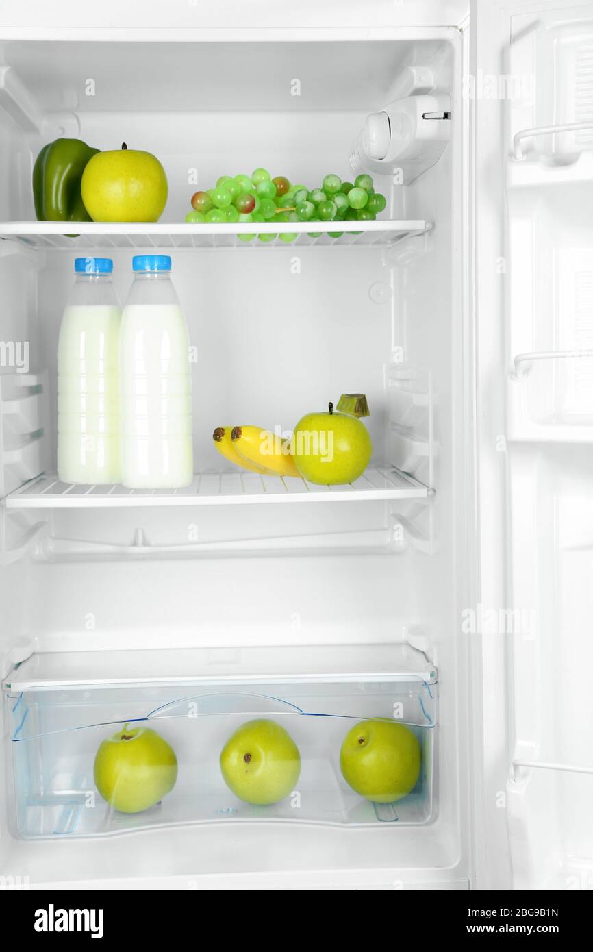 https://c8.alamy.com/comp/2BG9B1N/milk-bottles-vegetables-and-fruits-in-open-refrigerator-weight-loss-diet-concept-2BG9B1N.jpg