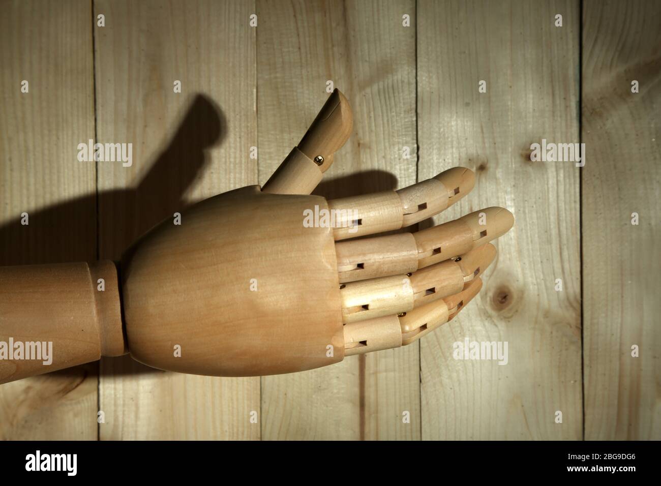 Wooden hand on wooden background Stock Photo