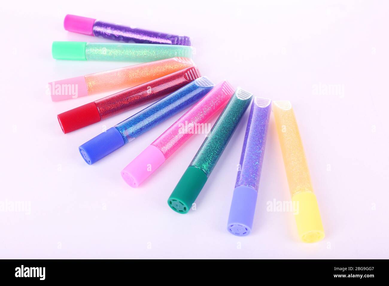 Colorful glitter glue isolated on white Stock Photo