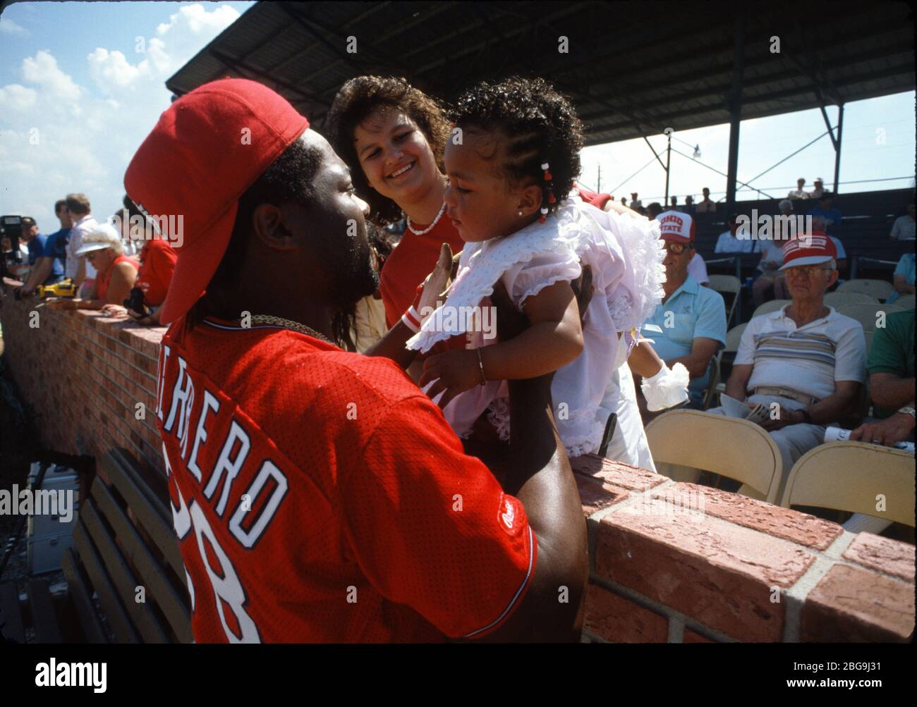 Cardinals Pedro Guerrero meets his wife, Denise and his baby