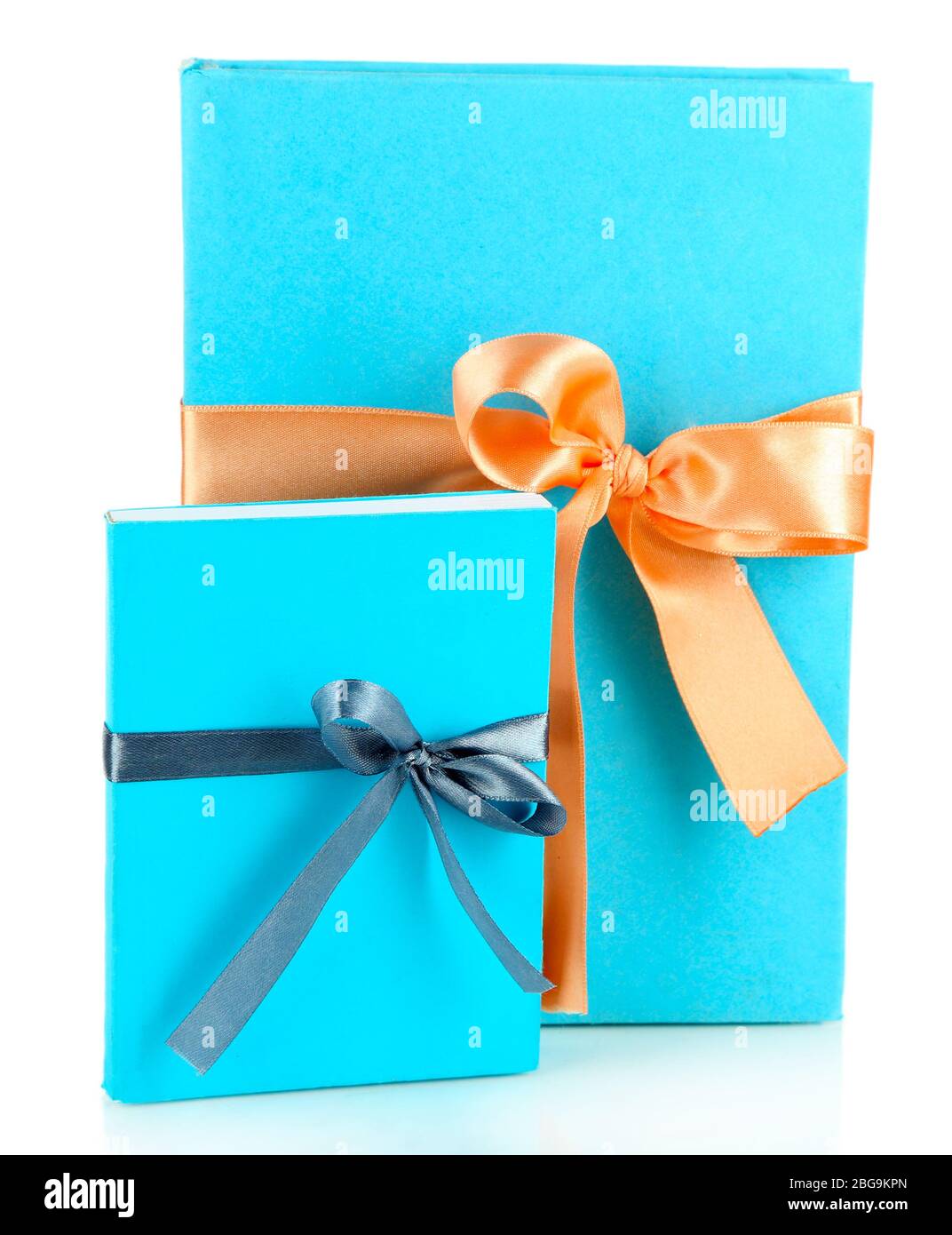 Books wrapped with color ribbons, isolated on white Stock Photo Alamy