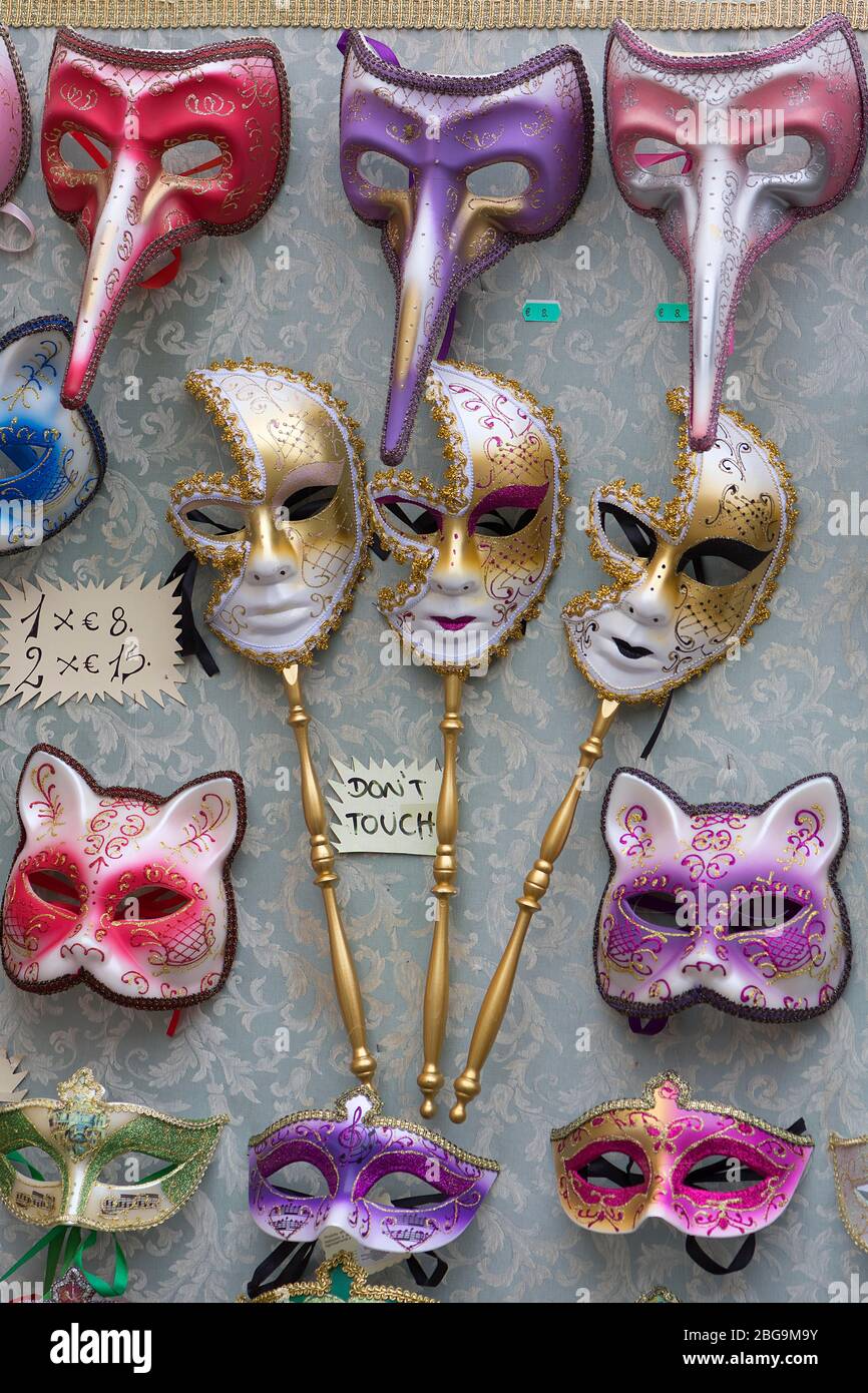 Venetian carnival masks in a shop window, Burano, Veneto, Italy Stock Photo