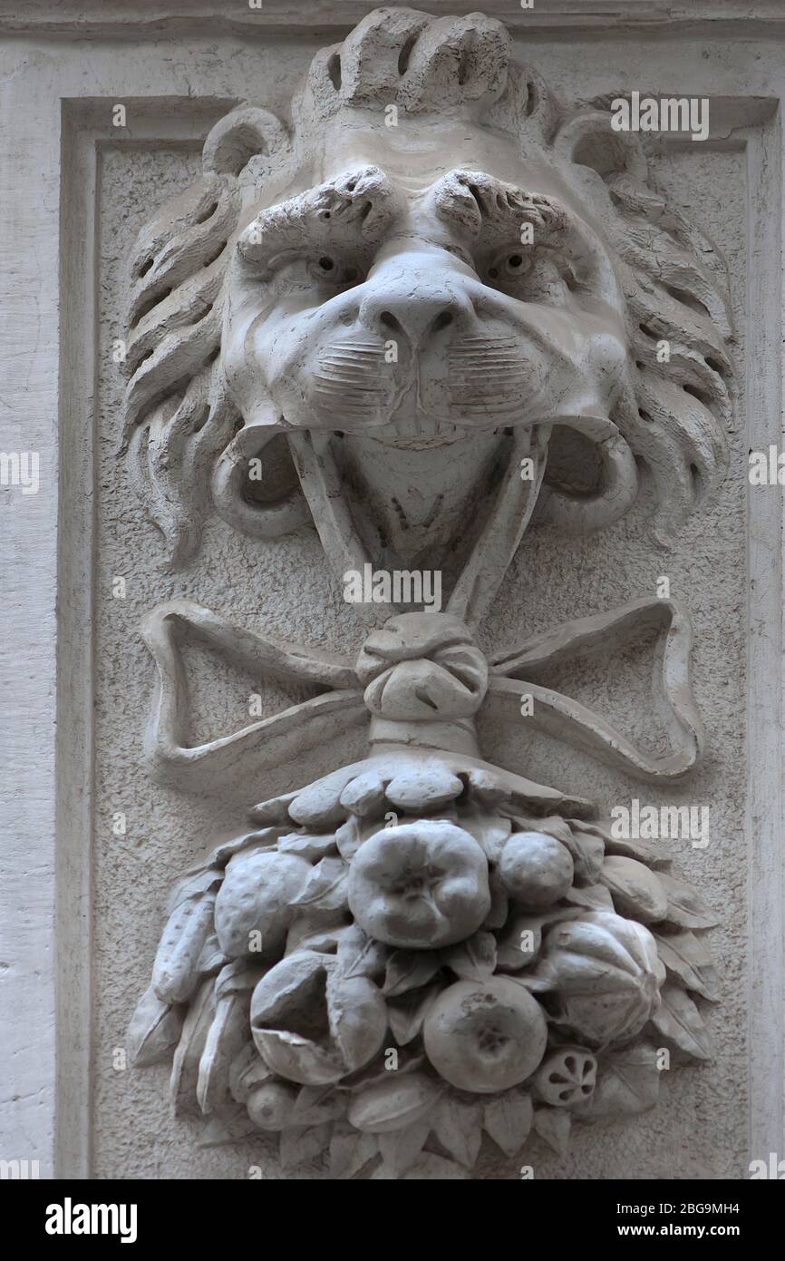 Lion holding fruit in his mouth, relief on a church, Venice, Veneto, Italy Stock Photo