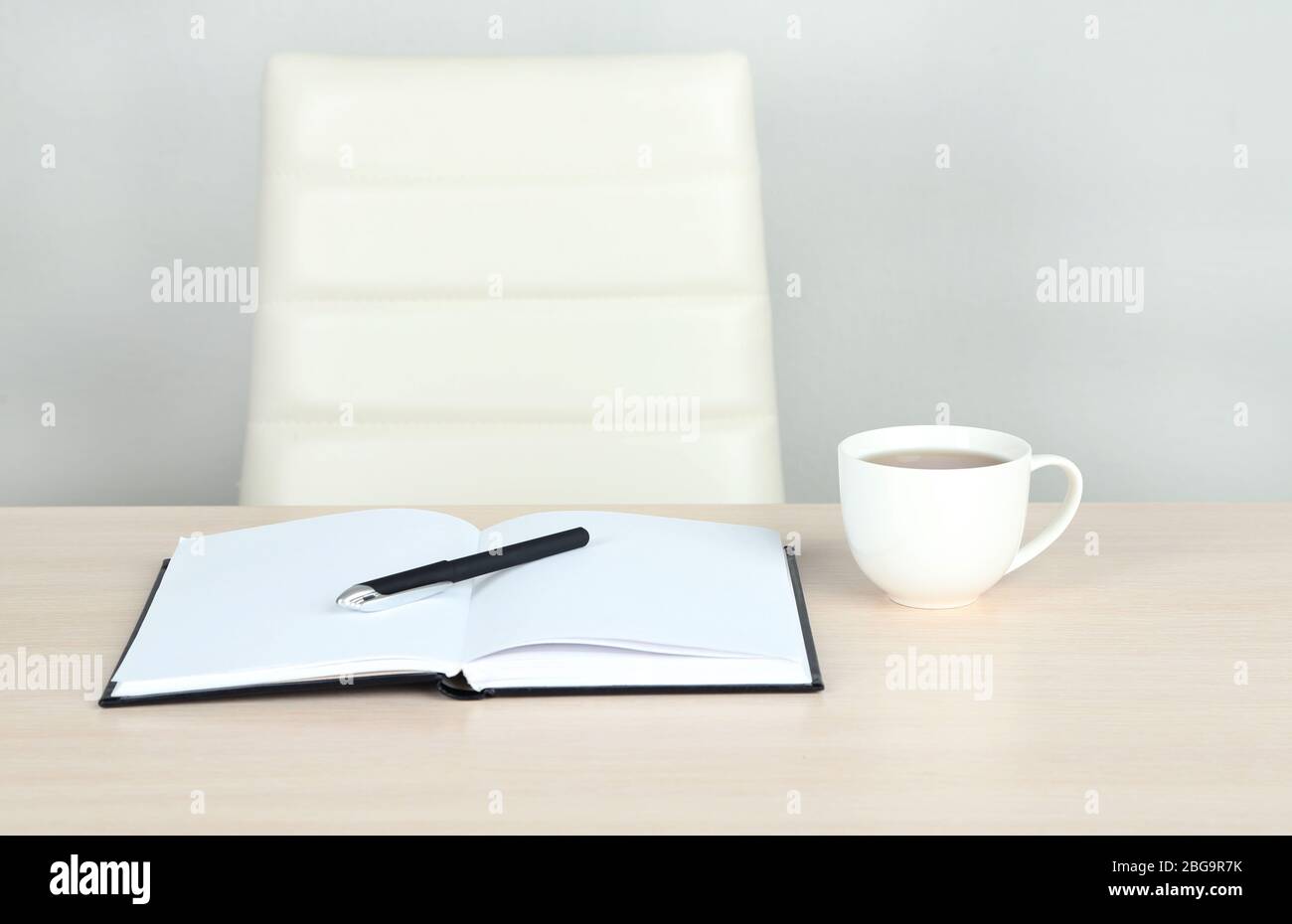 Empty workplace in office on gray background Stock Photo