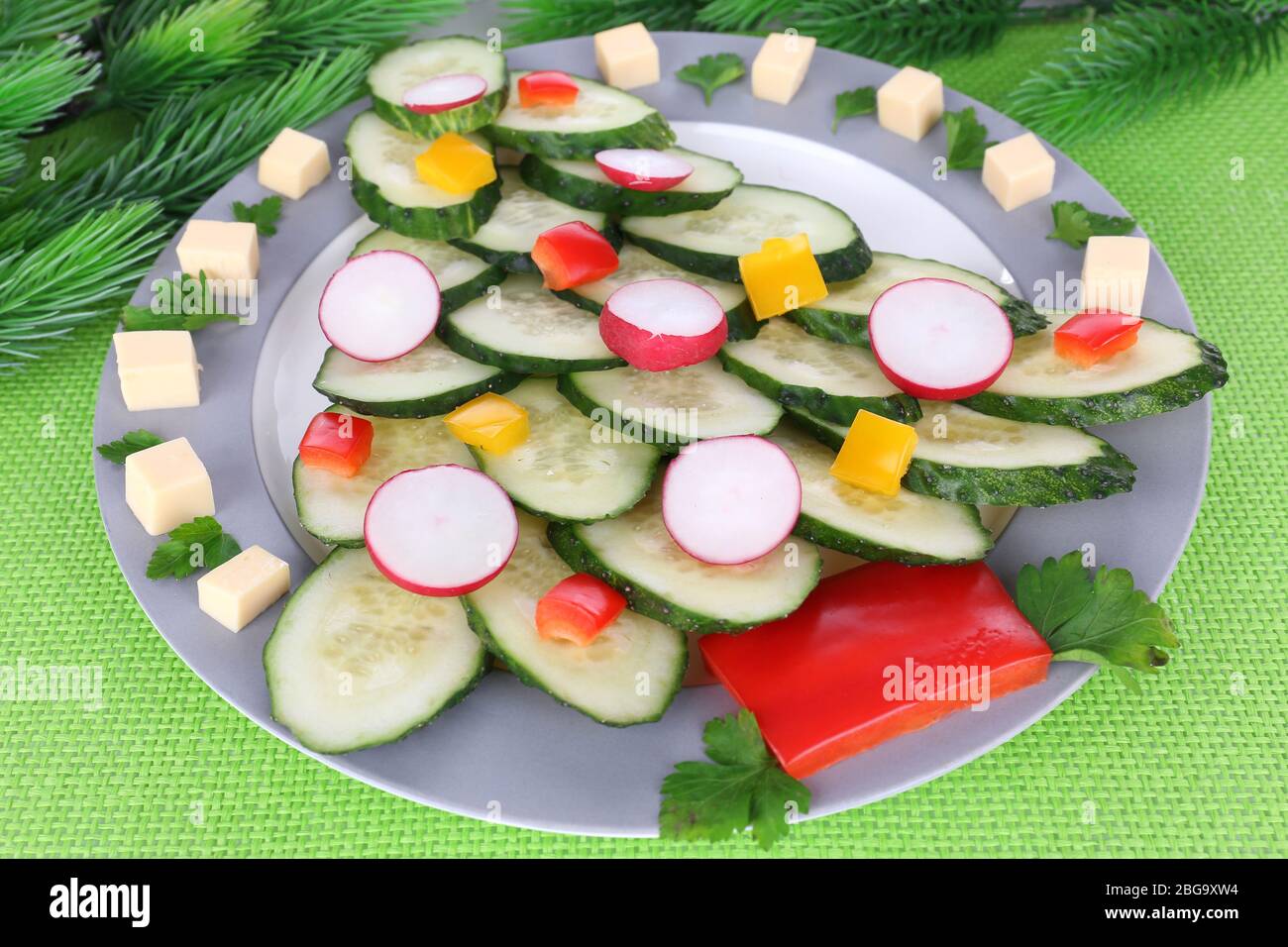 Christmas tree from cucumber on plate on table close-up Stock Photo