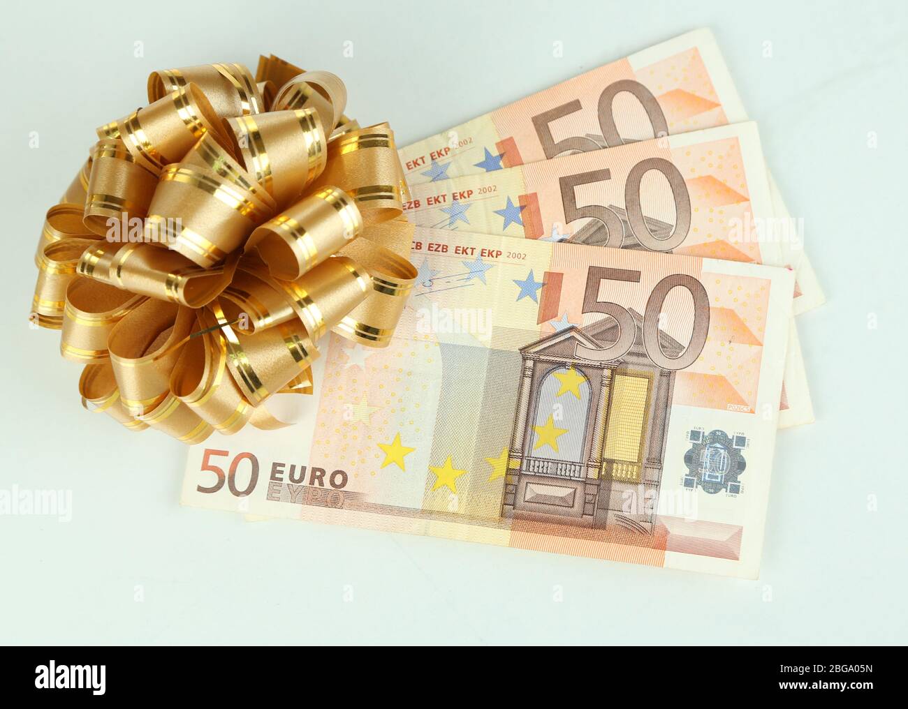 Euro banknotes with bow isolated on white Stock Photo - Alamy