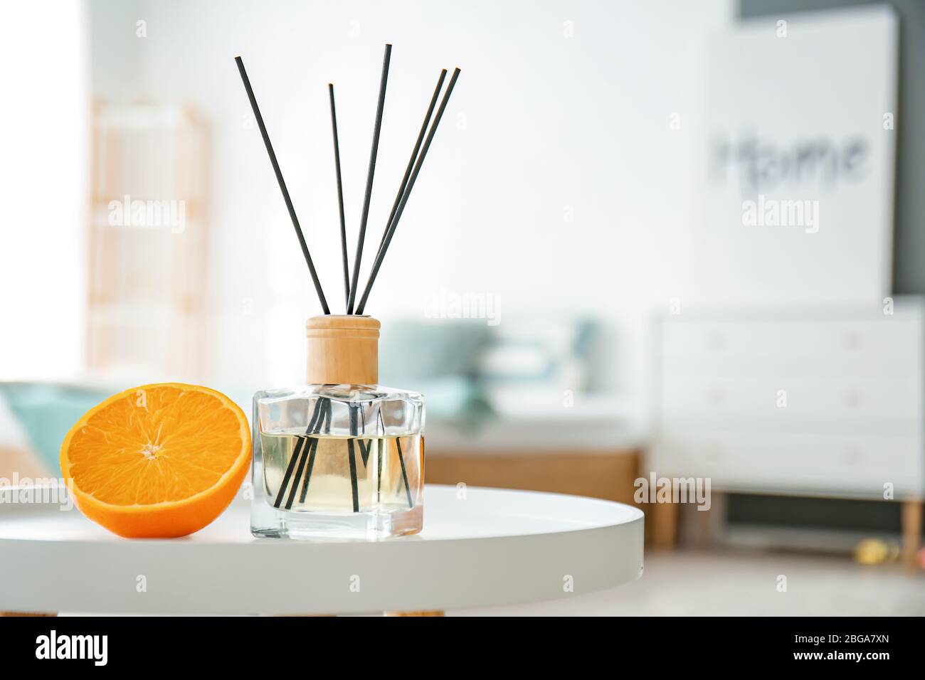 Reed diffuser on table in bedroom Stock Photo