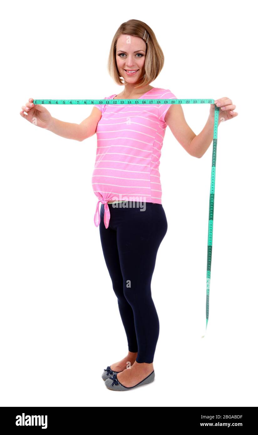 Young pregnant woman holding measuring tape isolated on white Stock