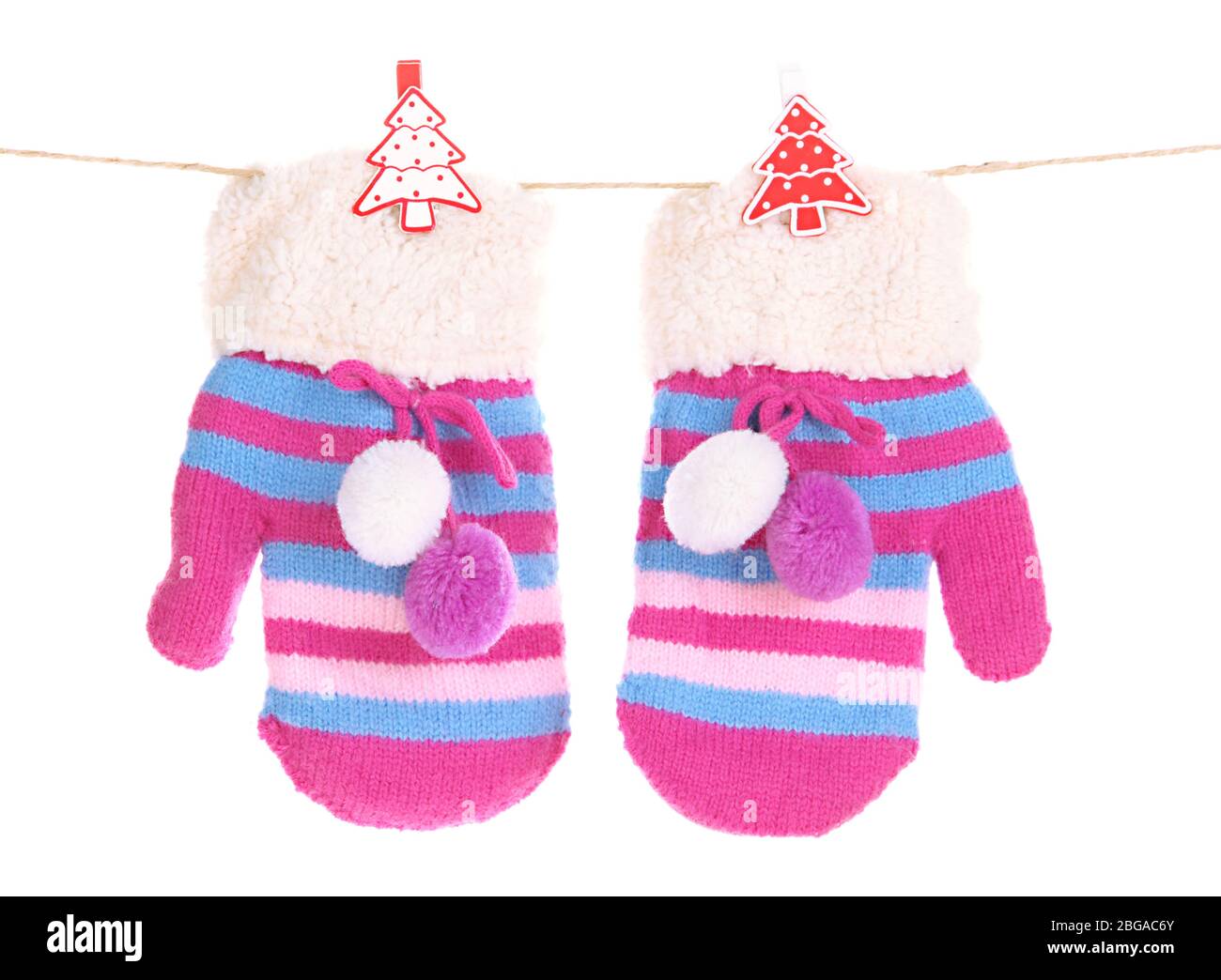 Striped mittens hanging on clothesline isolated on white Stock Photo