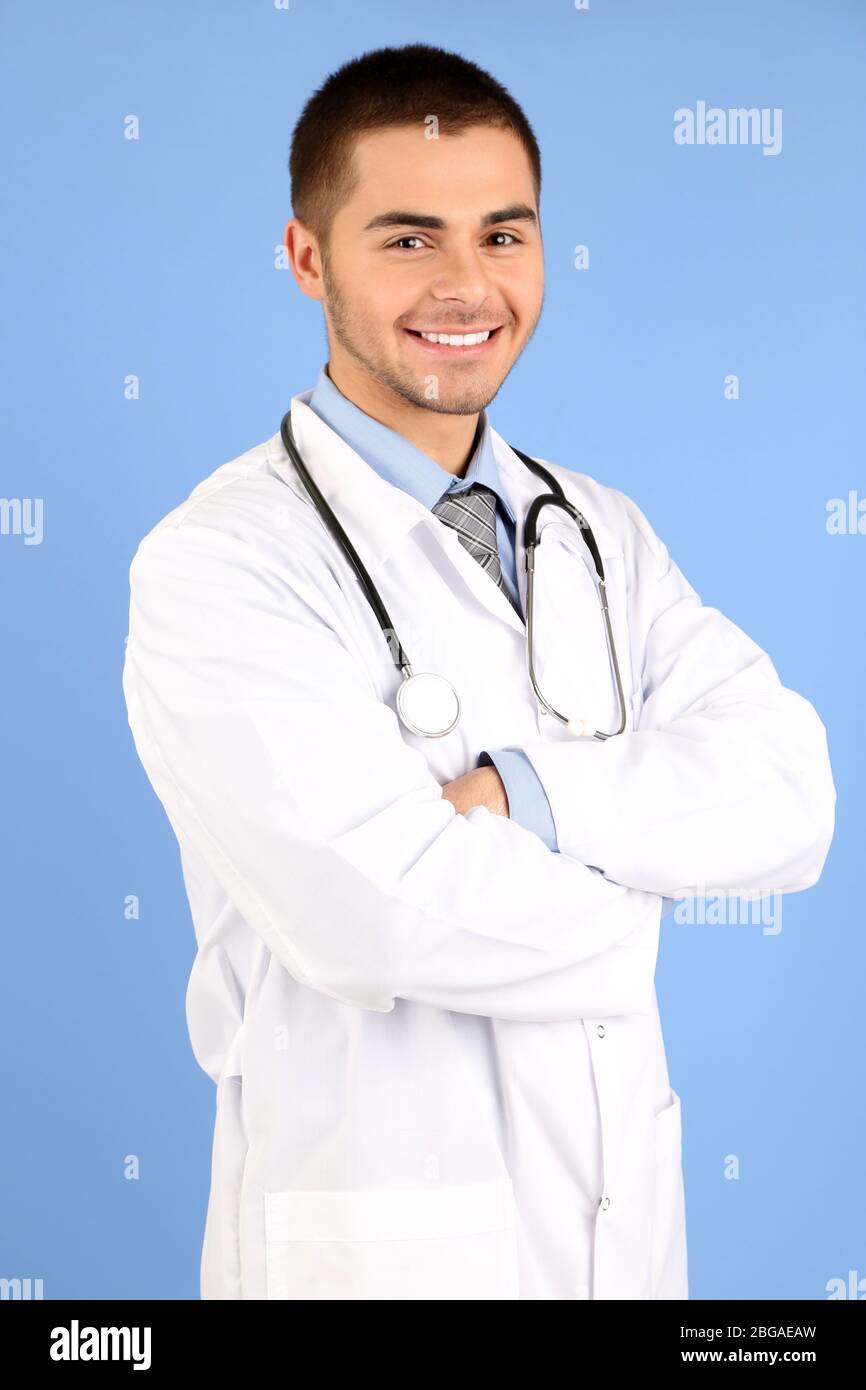 Male doctor standing folder hi-res stock photography and images - Alamy
