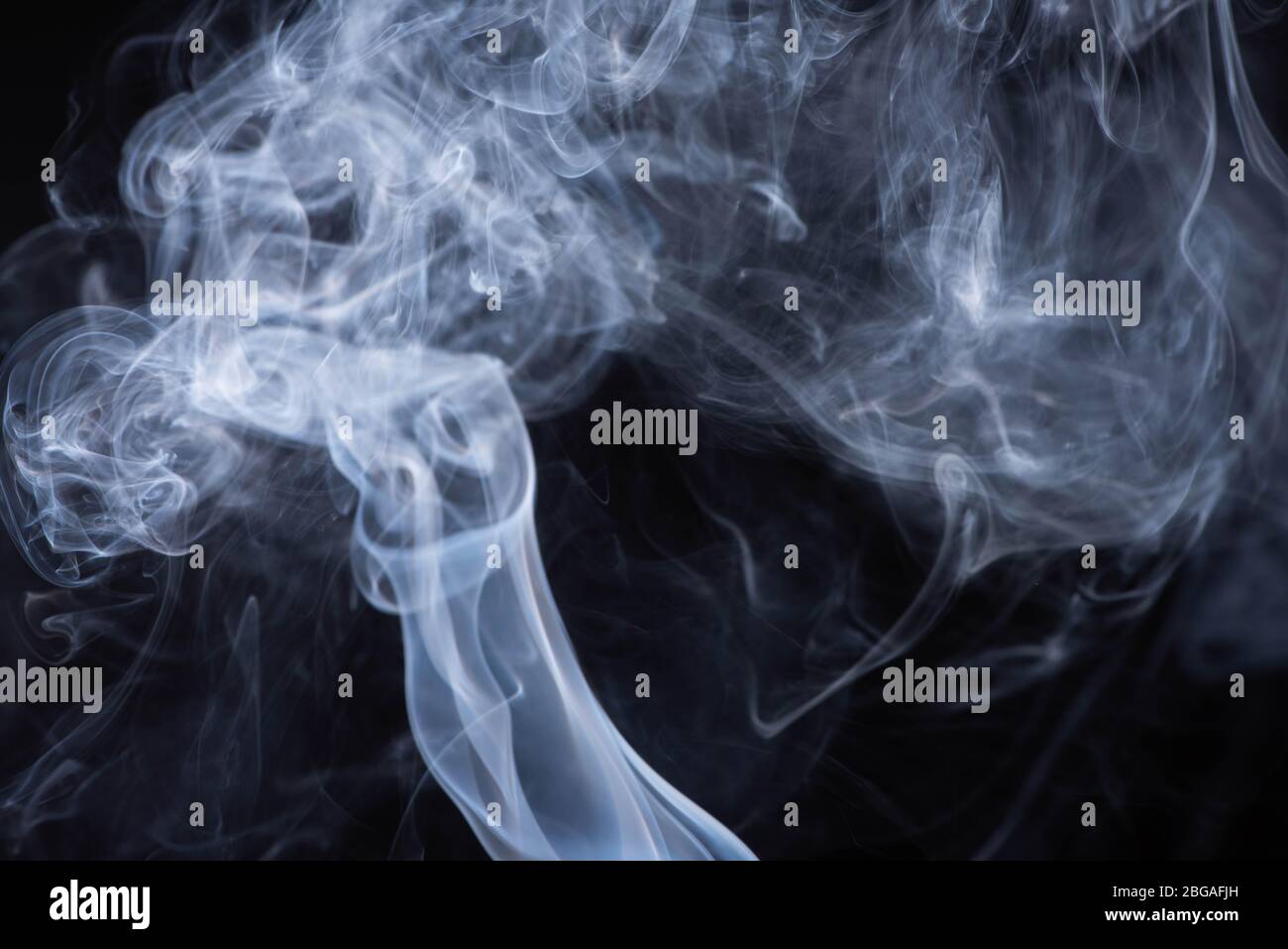 white flowing smoke cloud on black background Stock Photo - Alamy