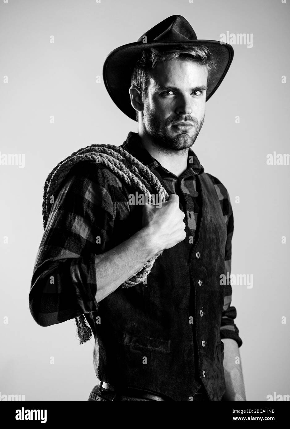 real man. Vintage style man. Wild West retro cowboy. cowboy with lasso ...