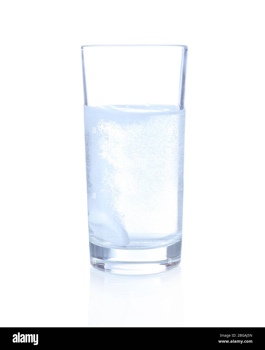 Glass with efervescent tablet in water with bubbles isolated on white Stock Photo